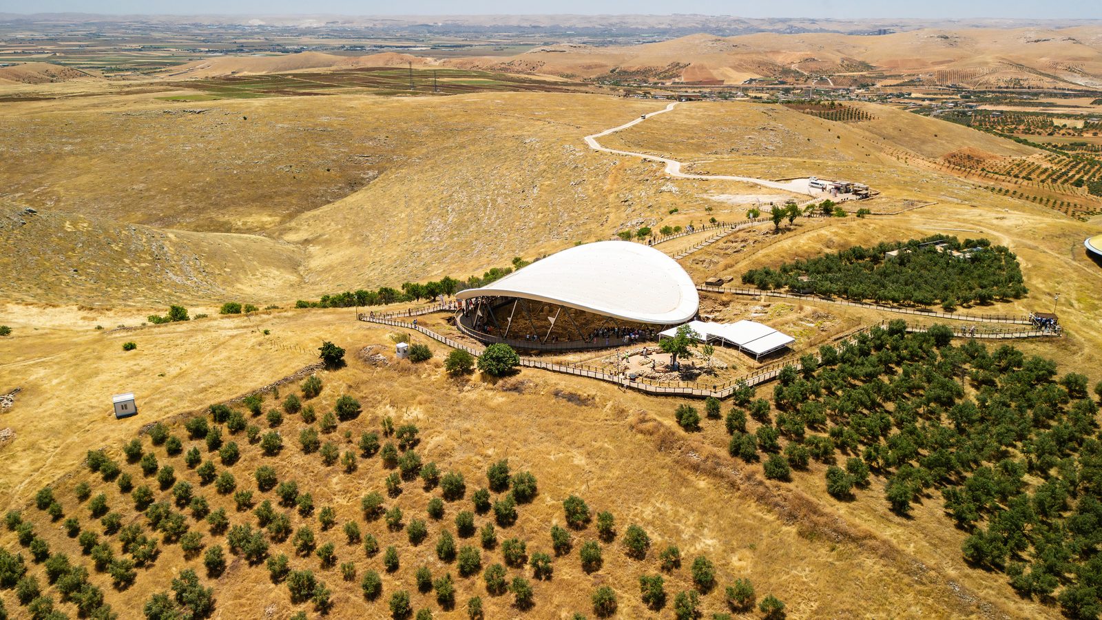 Göbekli Tepe from the air, its excavation shelter set among the fields