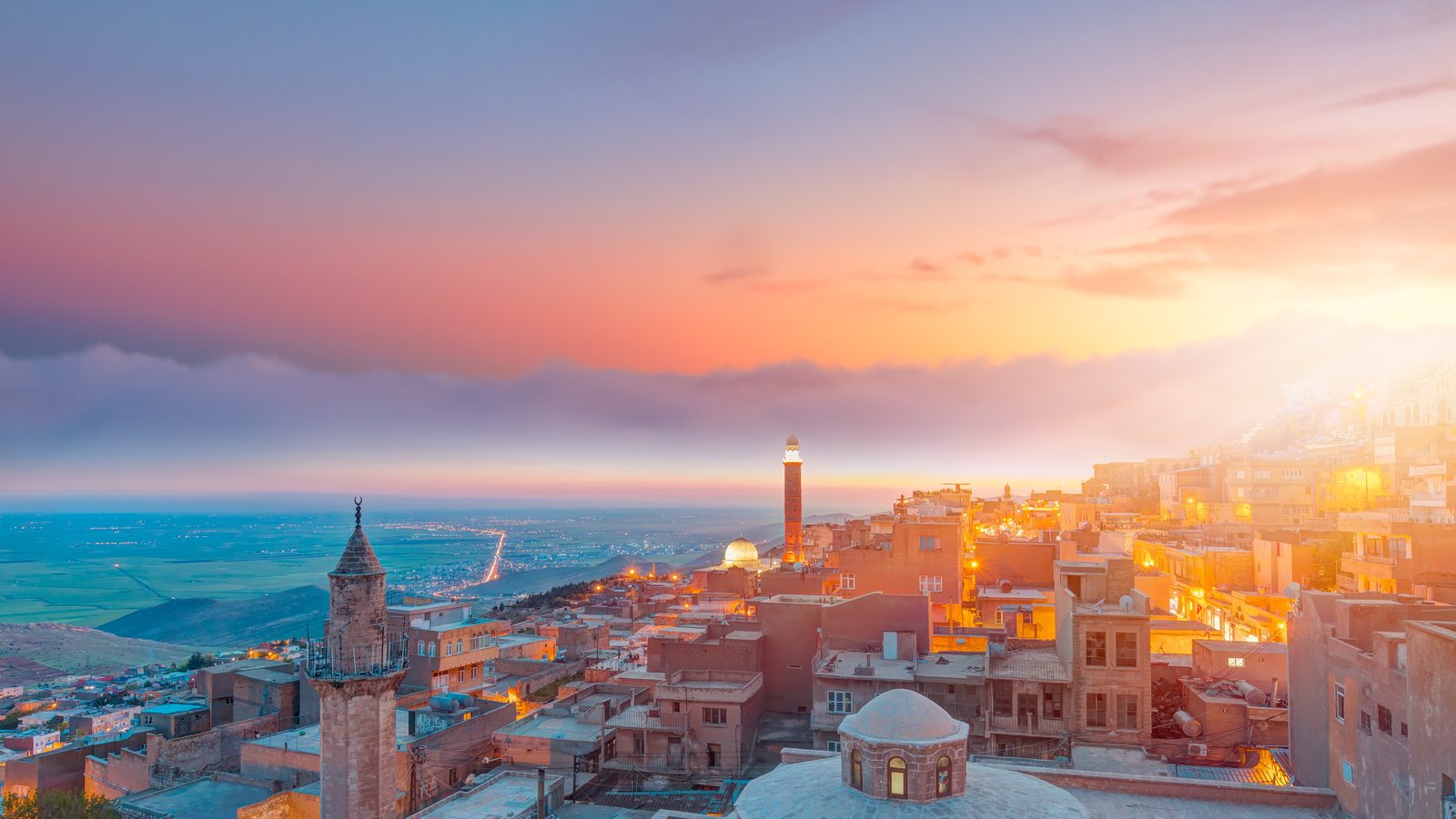 The honey-coloured stone terraces of old Mardin at sunset